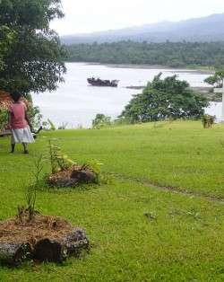 Landscape with woman and ship - climate justice, climate resilience