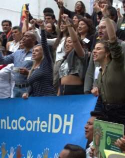 Diverse group of people standing in front of a building, gathering for a Pre-COP event organized by Chilean CSOs FIMA and CEUS.